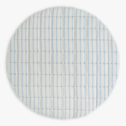 Round playmat with blue and white striped pattern on a white background