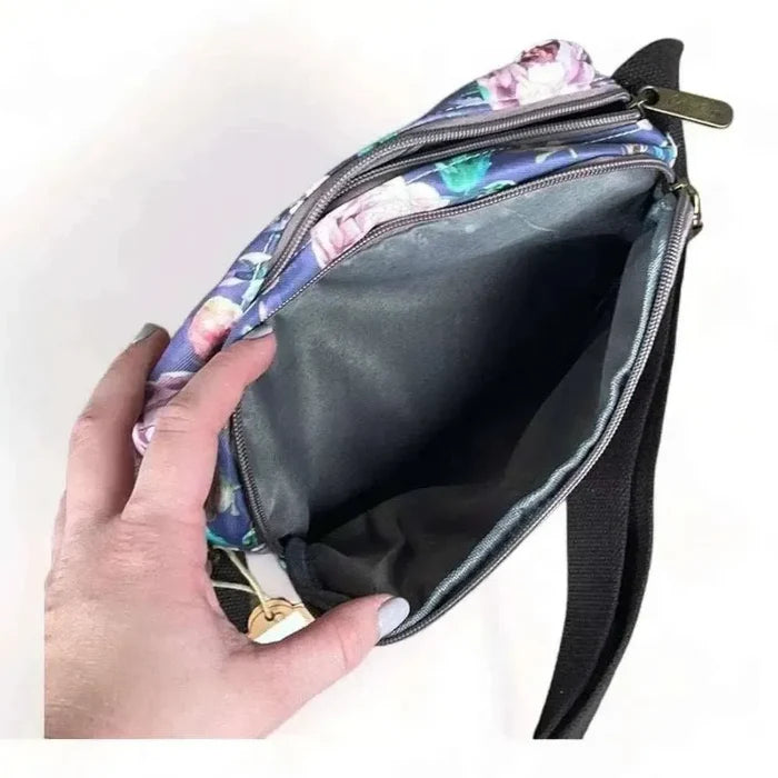 Canvas sling bag with purple flowers and adjustable shoulder strap