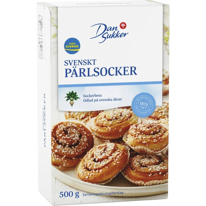 Dan Sukker Svenskt Pärlsocker 500g box – Swedish pearl sugar from Sweden, shown with freshly baked kanelbullar topped with pearl sugar, made by Dan Sukker since 1872