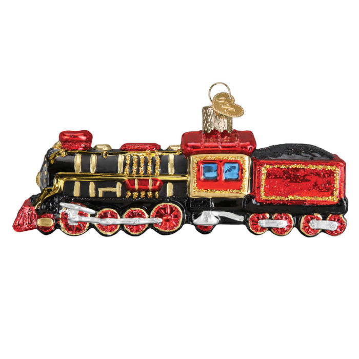 Glass train ornament with red and black design on a white background