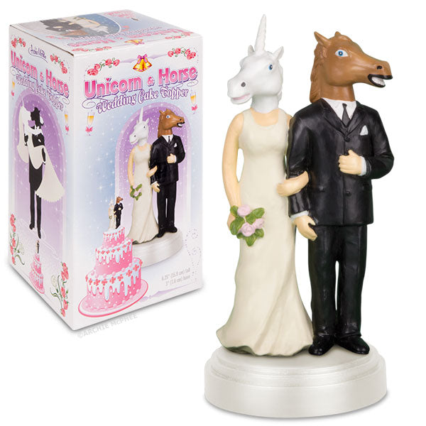 The unicorn and horse wedding cake topper, crafted from polystone and depicting a unicorn bride alongside a horse groom in formal attire, is elegantly displayed beside its box.