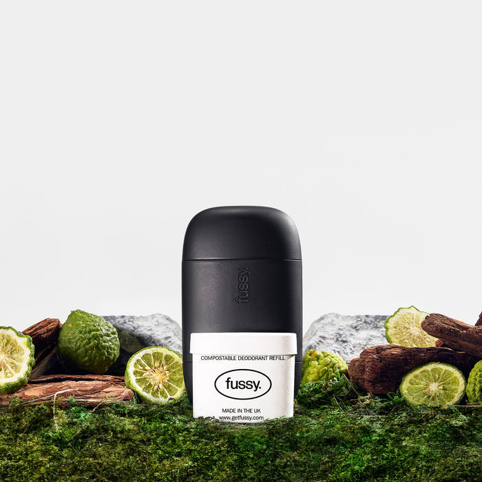 Fussy's natural, refillable deodorant starter pack in Wilderness scent (bergamot, cedarwood, vetiver) with deodorant case in Midnight colour.